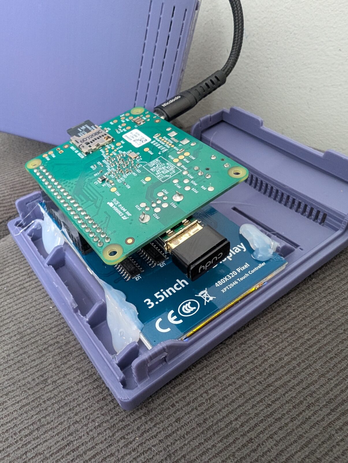 Inside the case: the Pi A+ on top of the display, with the WiFi dongle underneath